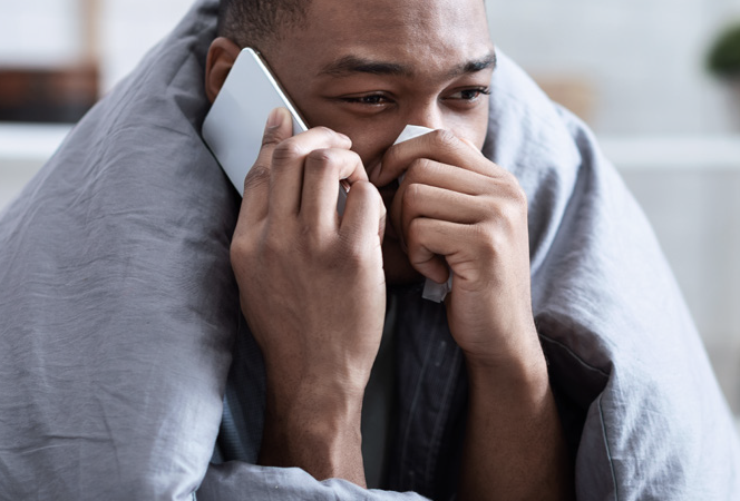 Stock photo of a man with a cold.